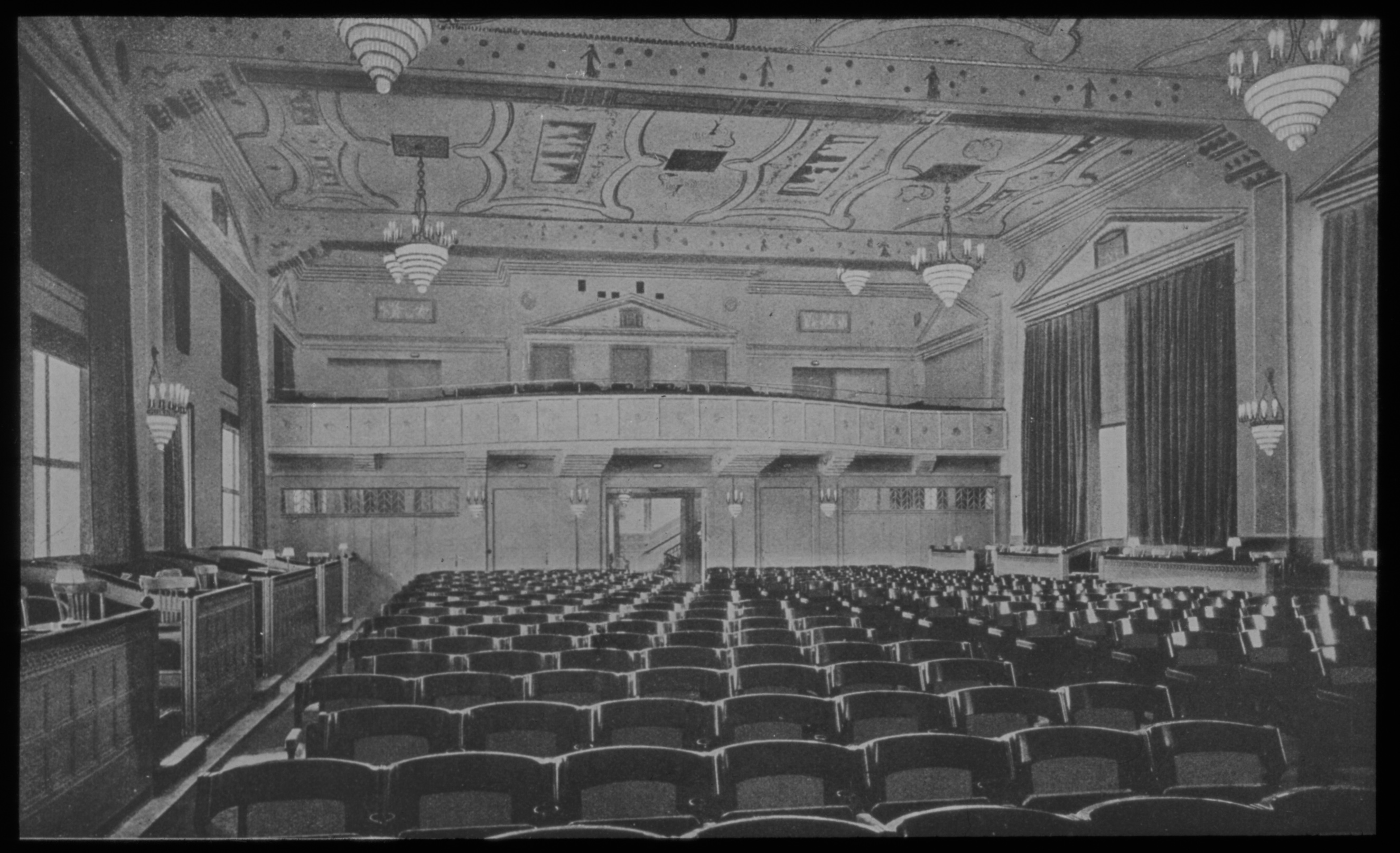 Black and white photo: auditorium facing the back.