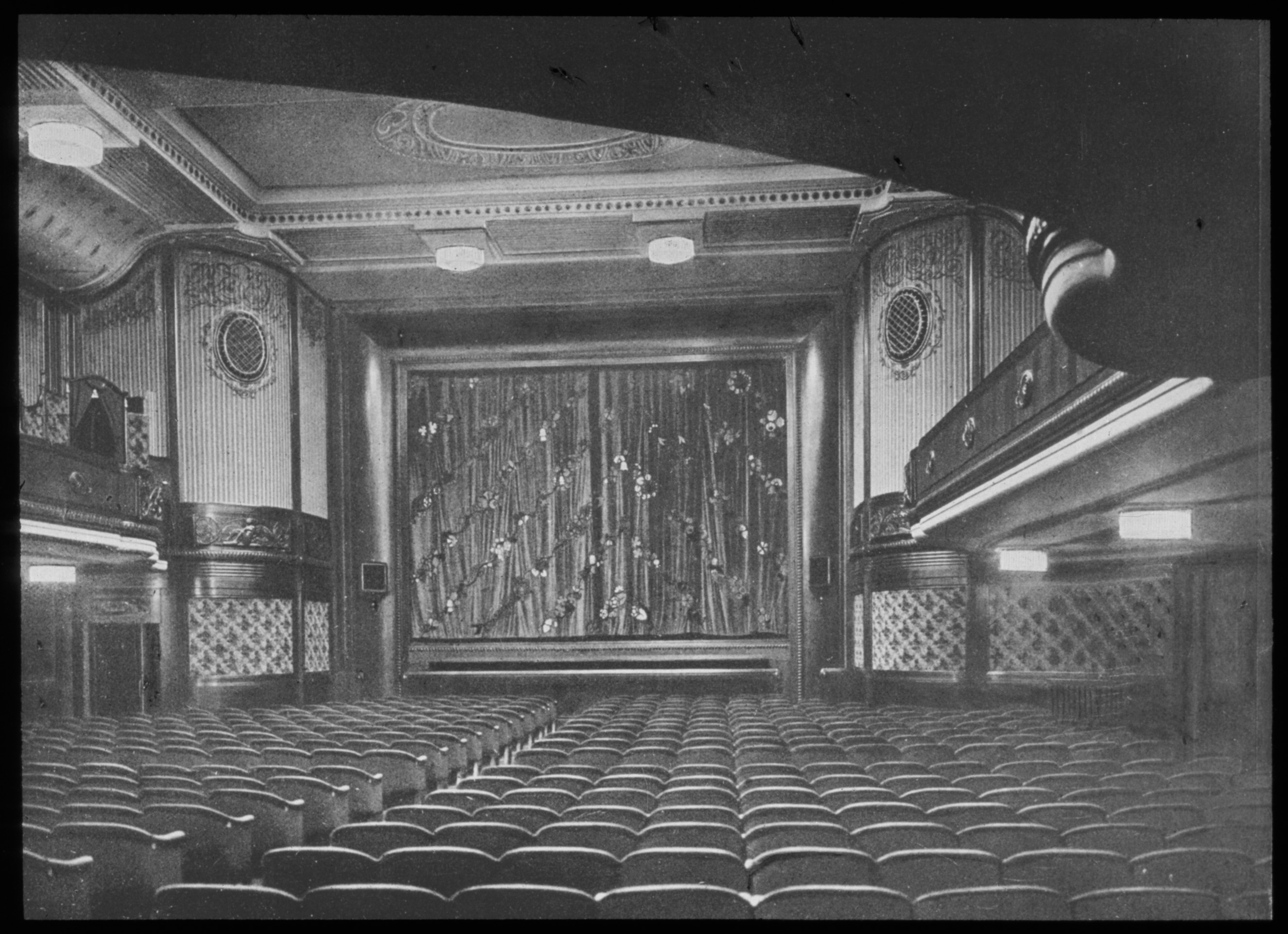 Black and white photo of the auditorium facing the screen