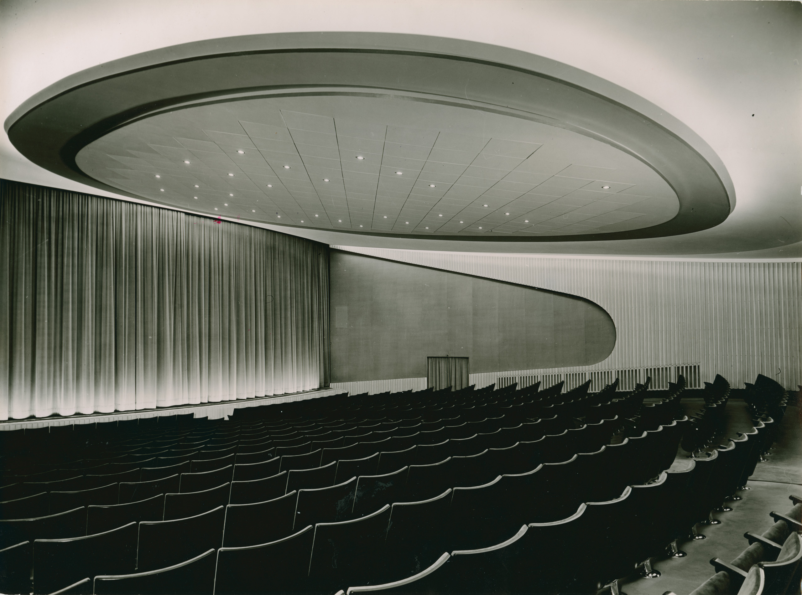 Black and white photo of the auditorium facing the screen