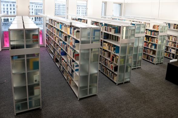 A book series that includes many books is on the shelf in the library.