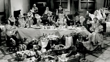 Ein ausgelassenes Gelage an einem festlich gedeckten Tisch, im 17. Jahrhundert.